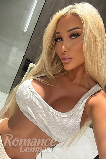 Ukrainian mail order bride Emilie from Copenhagen with blonde hair and blue eye color - image 1