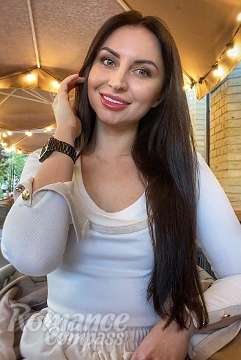 Ukrainian mail order bride Zhenya from Kyiv with light brown hair and green eye color - image 1