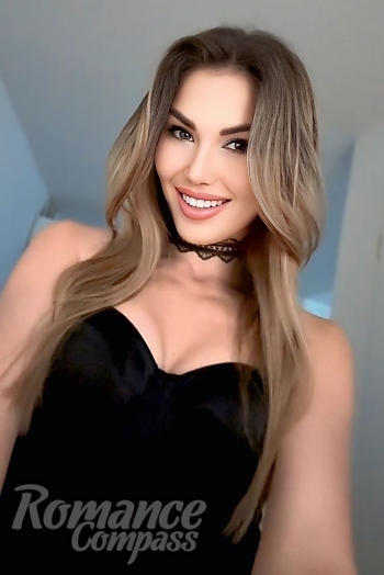 Ukrainian mail order bride Olivia from Montreal with light brown hair and blue eye color - image 1