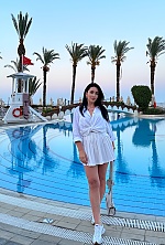 Ukrainian mail order bride Svitlana from Verona with black hair and green eye color - image 27