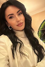 Ukrainian mail order bride Svitlana from Verona with black hair and green eye color - image 25