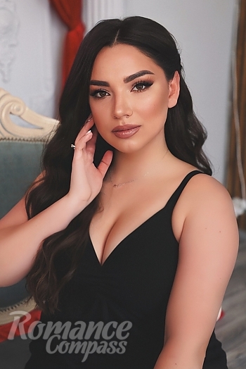 Ukrainian mail order bride Oleksandra from Mykolayiv with black hair and brown eye color - image 1