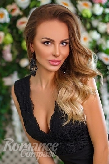 Ukrainian mail order bride Lyudmila from Zviahel with blonde hair and blue eye color - image 1