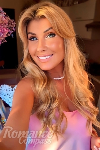 Ukrainian mail order bride Tetiana from Bucharest with blonde hair and blue eye color - image 1