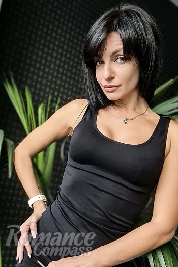 Ukrainian mail order bride Alina from Odesa with black hair and green eye color - image 1