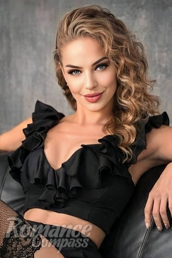 Ukrainian mail order bride Nina from Chisinau with light brown hair and blue eye color - image 1