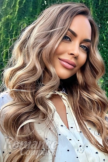 Ukrainian mail order bride Anastasiia from Kyiv with light brown hair and blue eye color - image 1