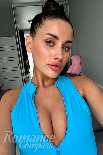Ukrainian mail order bride Polina from Odesa with black hair and green eye color - image 1