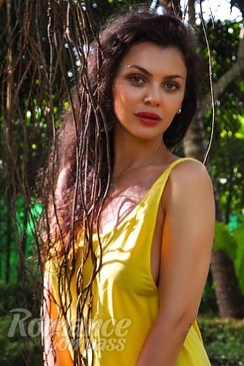 Ukrainian mail order bride Anastasia from Astana with black hair and green eye color - image 1