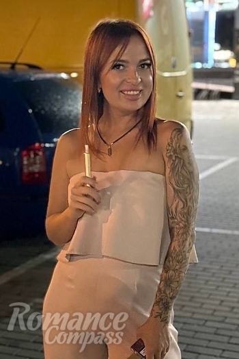 Ukrainian mail order bride Yana from Kyiv with red hair and green eye color - image 1