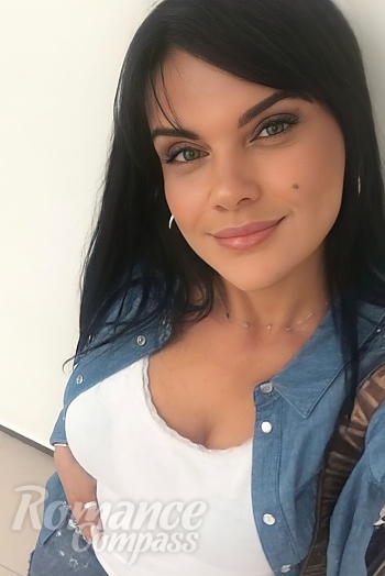 Ukrainian mail order bride Nataliia from Paris with black hair and grey eye color - image 1