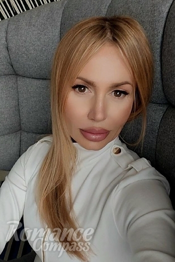 Ukrainian mail order bride Nadiia from Kyiv with blonde hair and brown eye color - image 1