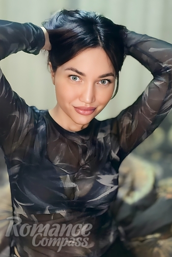 Ukrainian mail order bride Lyudmila from Slovyansk with black hair and blue eye color - image 1
