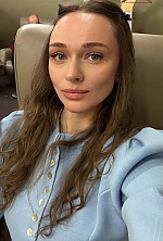 Ukrainian mail order bride Elina from Warsaw with light brown hair and blue eye color - image 4