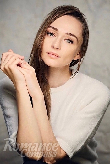 Ukrainian mail order bride Elina from Warsaw with light brown hair and blue eye color - image 1