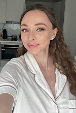 Ukrainian mail order bride Elina from Warsaw with light brown hair and blue eye color - image 9