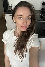 Ukrainian mail order bride Elina from Warsaw with light brown hair and blue eye color - image 7