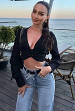 Ukrainian mail order bride Maria from Kyiv with black hair and green eye color - image 4