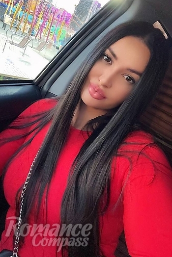 Ukrainian mail order bride Svitlana from Milan with black hair and black eye color - image 1