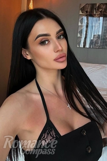 Ukrainian mail order bride Vitalina from Poltava with black hair and green eye color - image 1