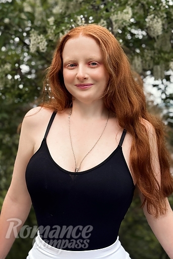 Ukrainian mail order bride Oleksandra from Cherkasy with auburn hair and blue eye color - image 1