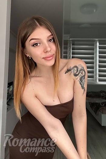 Ukrainian mail order bride Anastasiia from Kyiv with auburn hair and brown eye color - image 1