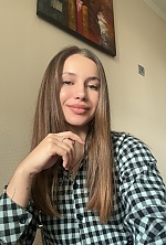 Ukrainian mail order bride Ruslana from Khmelnytskyi with light brown hair and hazel eye color - image 9