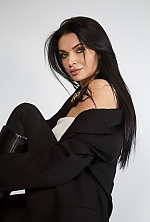 Ukrainian mail order bride Anastasiia from Kyiv with black hair and green eye color - image 4