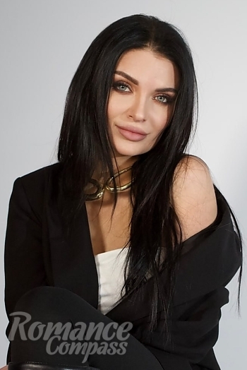 Ukrainian mail order bride Anastasiia from Kyiv with black hair and green eye color - image 1