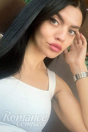 Ukrainian mail order bride Kateryna from Kyiv with black hair and blue eye color - image 1