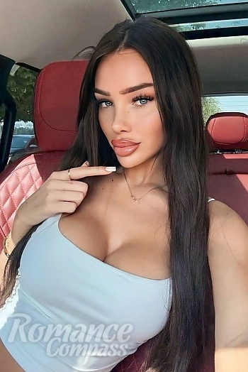 Ukrainian mail order bride Megan from London with brunette hair and blue eye color - image 1