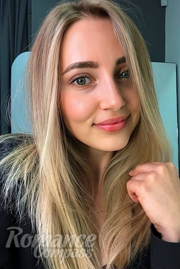 Ukrainian mail order bride Oksana from Kyiv with light brown hair and blue eye color - image 1