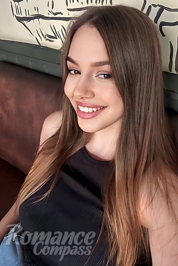Ukrainian mail order bride Yuliia from Kyiv with light brown hair and brown eye color - image 1