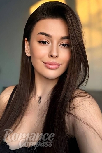 Ukrainian mail order bride Victoria from Lviv with auburn hair and hazel eye color - image 1