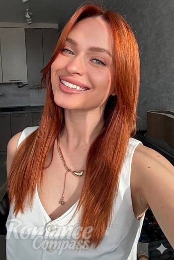 Ukrainian mail order bride Kateryna from Lviv with red hair and green eye color - image 1