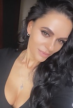 Ukrainian mail order bride Svetlana from Warsaw with black hair and hazel eye color - image 10