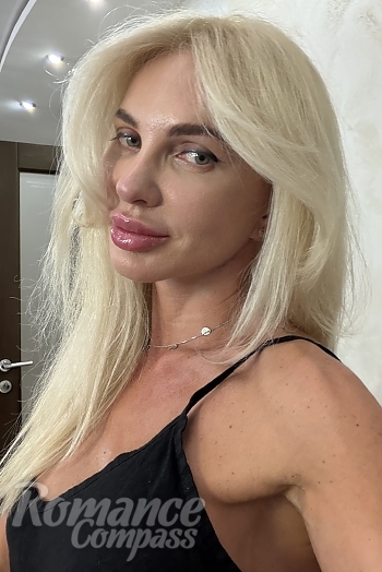 Ukrainian mail order bride Yana from Dnipro with blonde hair and green eye color - image 1