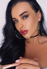 Ukrainian mail order bride Karyna from Kyiv with black hair and green eye color - image 2
