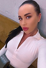 Ukrainian mail order bride Karyna from Kyiv with black hair and green eye color - image 3
