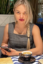Ukrainian mail order bride Svitlana from Bucharest with blonde hair and blue eye color - image 9