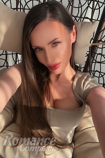 Ukrainian mail order bride Oksana from Brussels with brunette hair and green eye color - image 1
