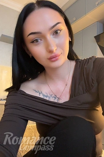 Ukrainian mail order bride Vladeslava from Odesa with black hair and green eye color - image 1