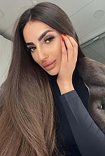 Ukrainian mail order bride Sandra from Tbilisi with black hair and green eye color - image 15