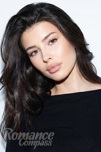 Ukrainian mail order bride Evelina from Kyiv with light brown hair and brown eye color - image 1