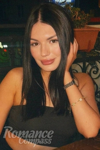 Ukrainian mail order bride Daria from Rivne with black hair and brown eye color - image 1