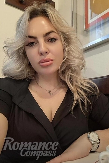 Ukrainian mail order bride Ganna from Verona with blonde hair and green eye color - image 1