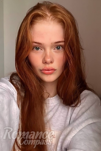 Ukrainian mail order bride Sofiia from Hangzhou with red hair and blue eye color - image 1