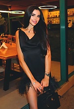 Ukrainian mail order bride Nelia from Sumy with black hair and green eye color - image 7