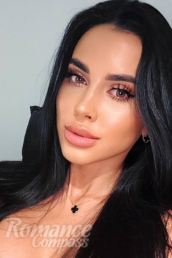 Ukrainian mail order bride Nelia from Sumy with black hair and green eye color - image 1