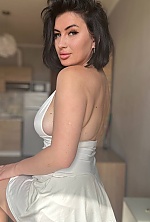 Ukrainian mail order bride Snizhana from Berlin with black hair and green eye color - image 5